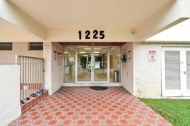 view of exterior entry featuring french doors