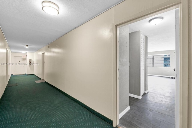 corridor with a textured ceiling