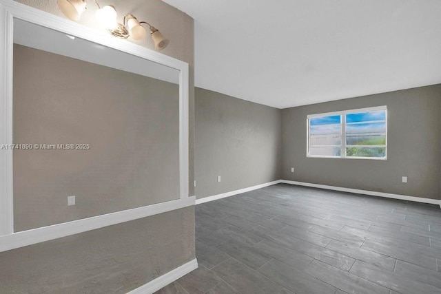 empty room featuring dark wood-type flooring