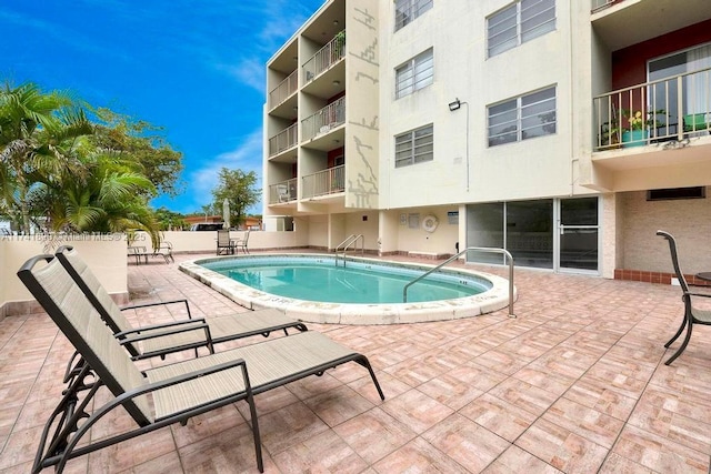 view of pool with a patio area