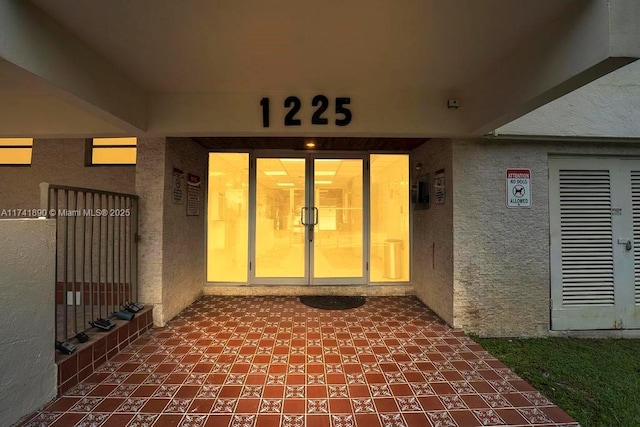 doorway to property featuring a patio area