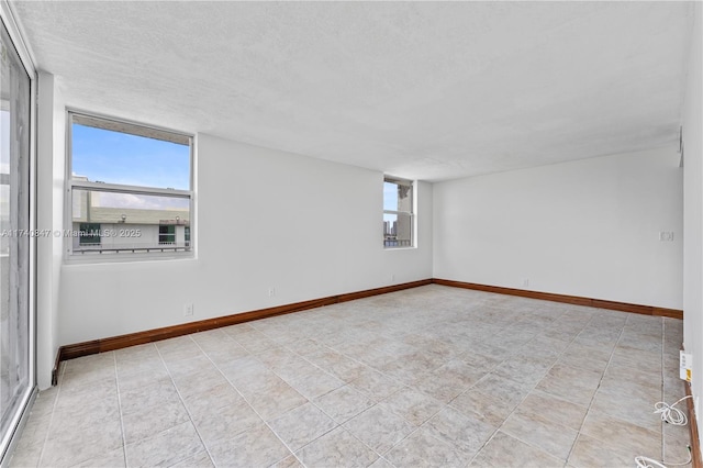 spare room featuring a textured ceiling