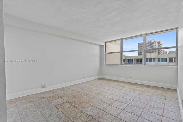 empty room featuring a textured ceiling