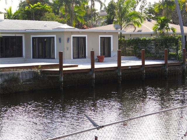 rear view of property featuring a water view