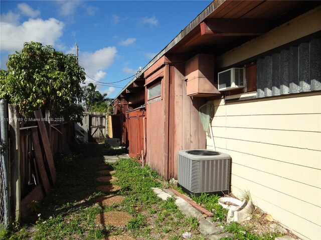 view of side of property featuring central AC and cooling unit