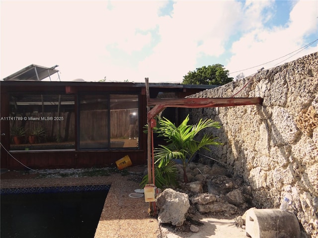 exterior space with a sunroom