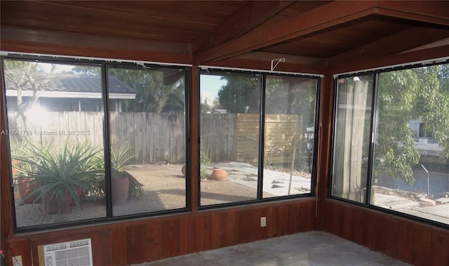 unfurnished sunroom with wood ceiling and lofted ceiling with beams