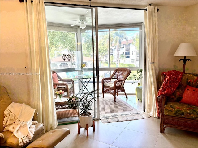 doorway to outside featuring ceiling fan, tile patterned floors, and plenty of natural light