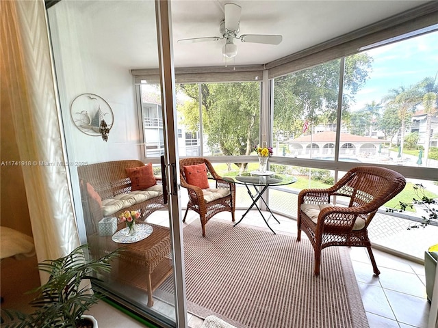sunroom featuring ceiling fan