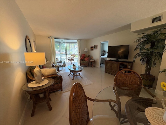 living room with light tile patterned flooring