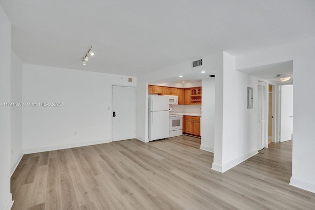 unfurnished living room featuring light wood-type flooring