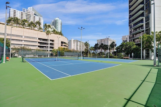 view of tennis court featuring basketball court