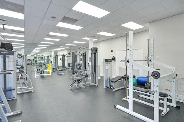 workout area with a paneled ceiling