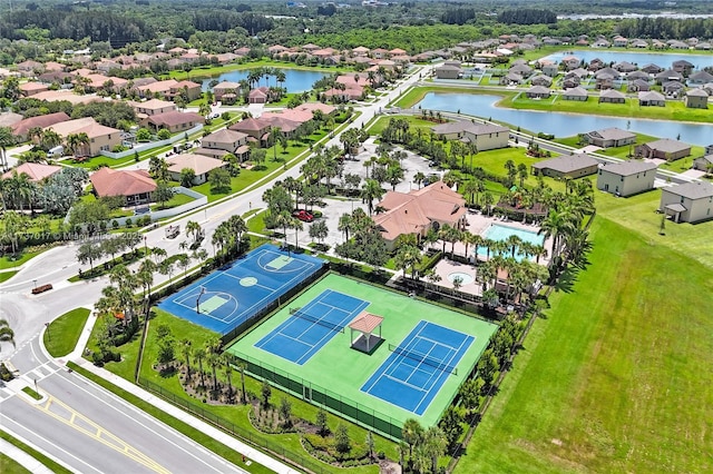 birds eye view of property with a water view