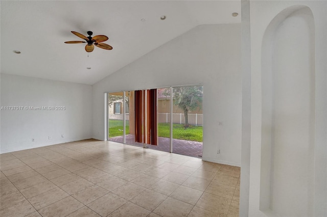 spare room featuring ceiling fan, light tile patterned floors, and high vaulted ceiling