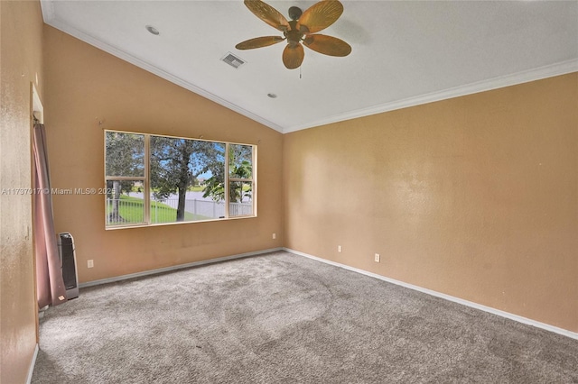 carpeted spare room featuring crown molding, ceiling fan, and lofted ceiling