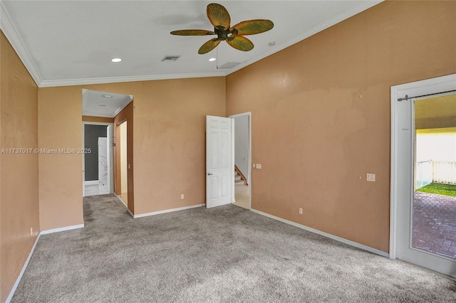 carpeted spare room with ornamental molding and ceiling fan