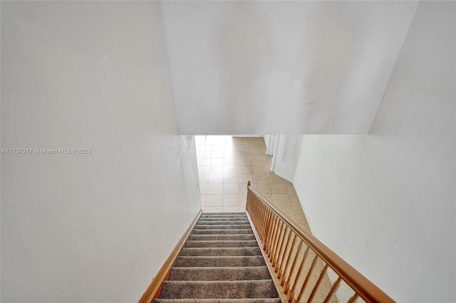 stairs with vaulted ceiling