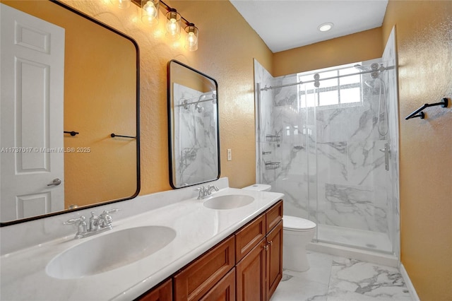 bathroom with vanity, toilet, and an enclosed shower