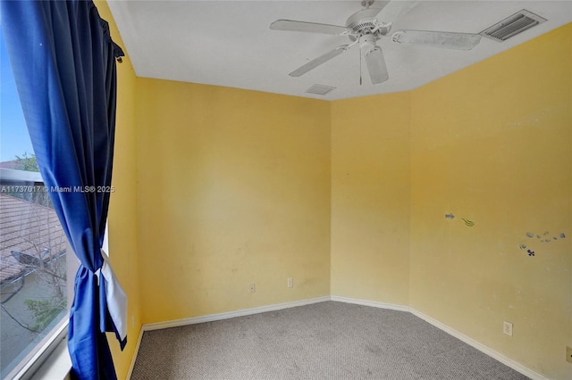 spare room with ceiling fan and carpet flooring