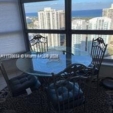 dining space featuring a water view and a wealth of natural light