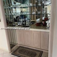 bar with light tile patterned floors