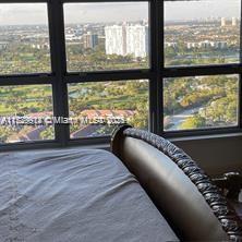 bedroom featuring multiple windows