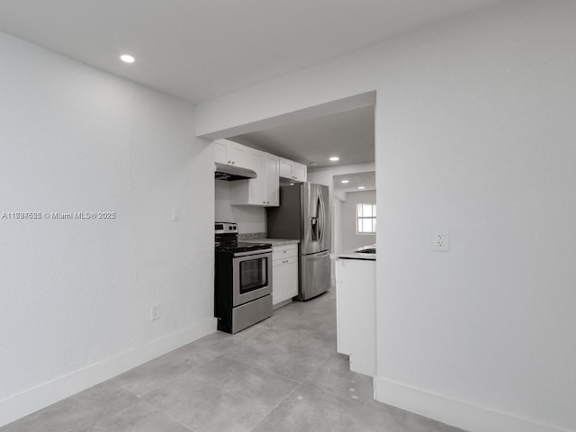 kitchen with white cabinetry and appliances with stainless steel finishes