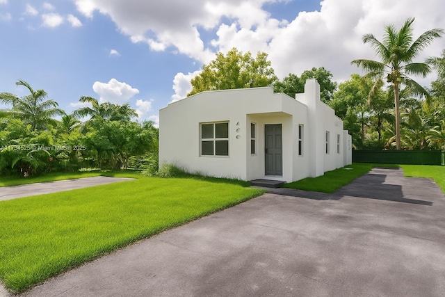 460 NW 82nd Ter, Miami, FL 33150 - view of front of property with stucco siding and a front yard