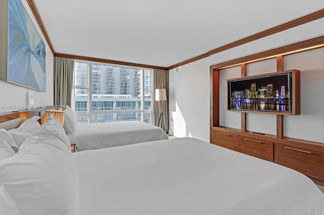 bedroom with ornamental molding