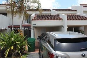 view of front of property featuring a tiled roof