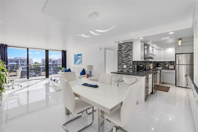 dining space featuring light tile patterned floors