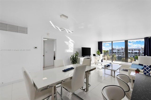 tiled dining space with expansive windows