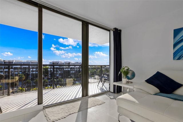 bedroom featuring a wall of windows and multiple windows