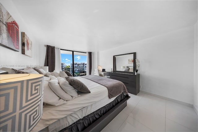 tiled bedroom featuring floor to ceiling windows