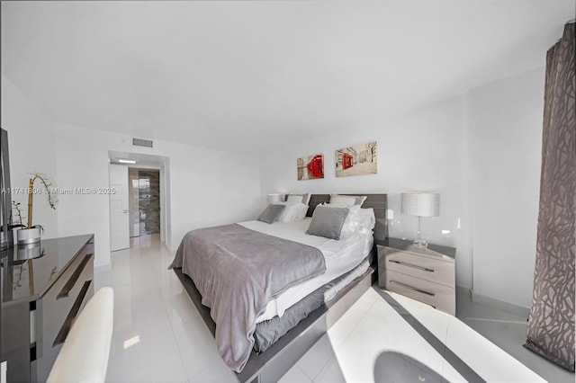 bedroom featuring light tile patterned floors