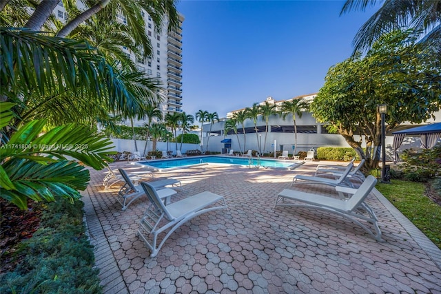view of swimming pool featuring a patio area