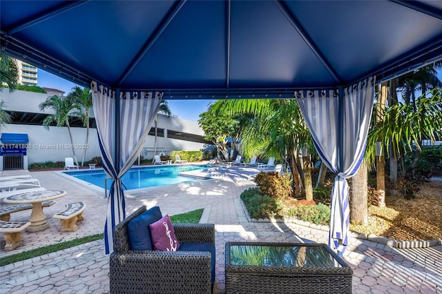 view of pool featuring a gazebo and a patio