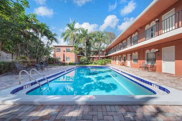 view of swimming pool with a patio