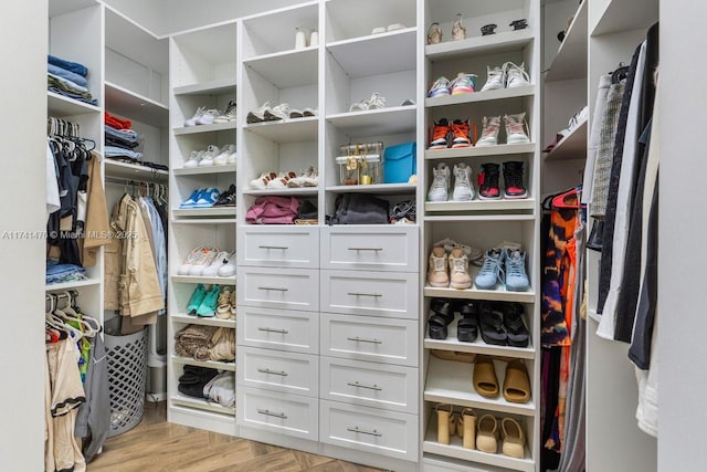 walk in closet featuring light wood-type flooring