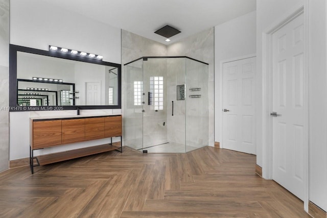 bathroom featuring vanity, parquet flooring, and walk in shower