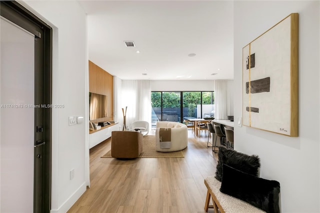 living room with light hardwood / wood-style flooring