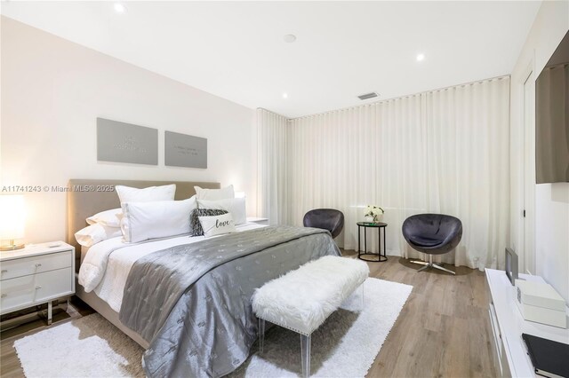 bedroom featuring light wood-type flooring