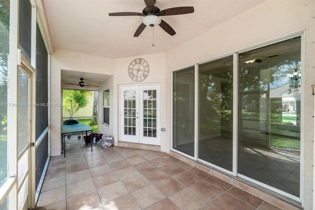 unfurnished sunroom with french doors