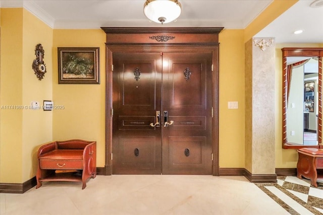 interior space featuring ornamental molding and baseboards