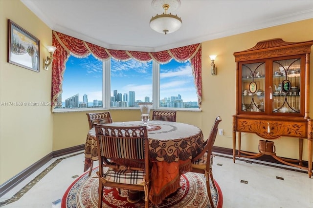 dining room with a city view, crown molding, and baseboards