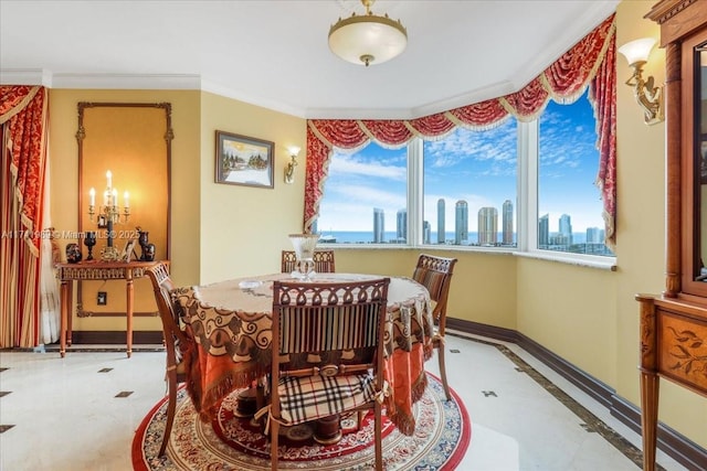 dining space with baseboards, ornamental molding, and a city view