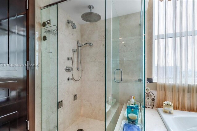 full bath featuring a shower stall