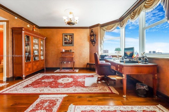 office space featuring a chandelier, ornamental molding, baseboards, and wood finished floors