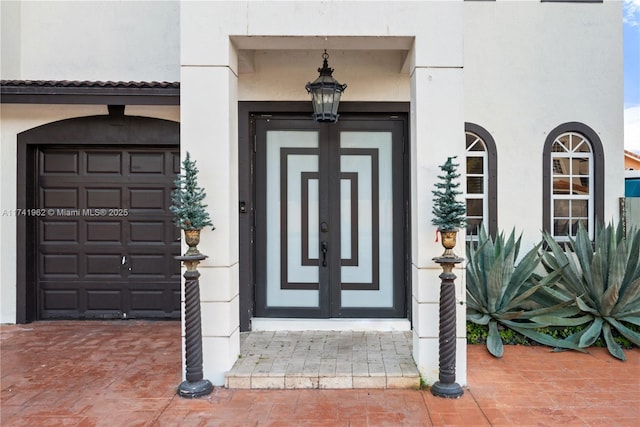 entrance to property featuring french doors